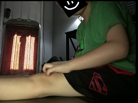 7-year-old me sitting by a heater.