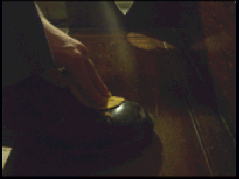 Some random guy polishing his shoe