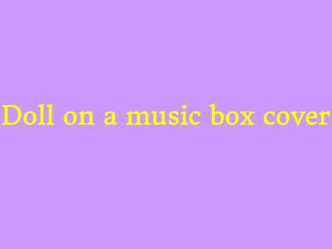 Doll on music box cover!